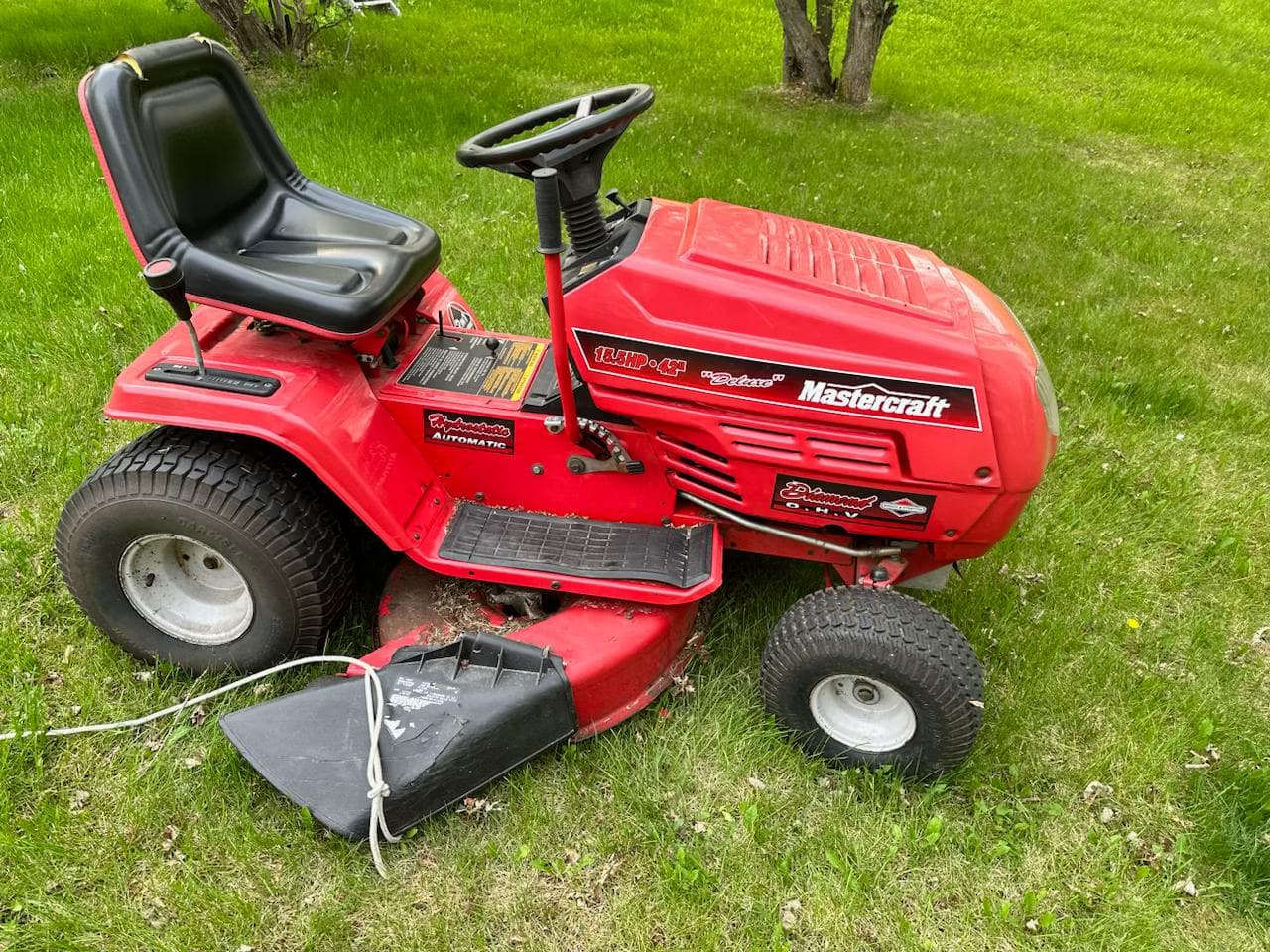 Technician repairing a lawn mower